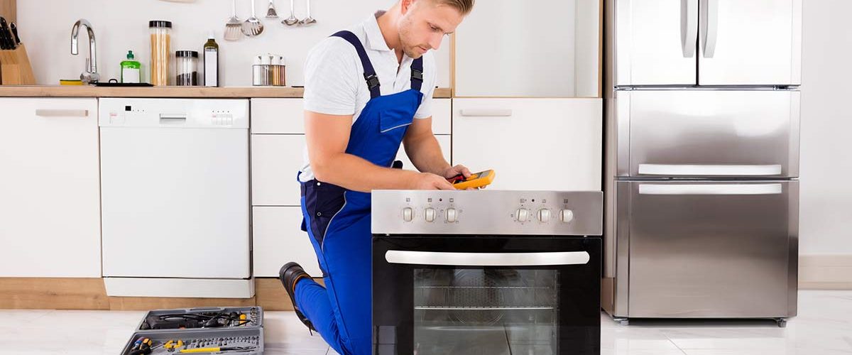 Technician-Checking-Oven Technician-Checking-Oven